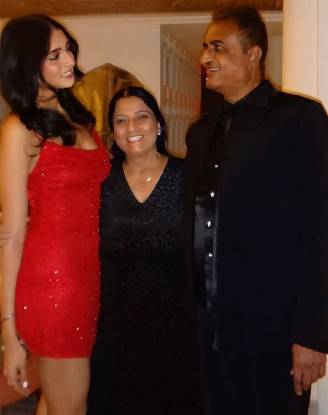 Riya with her mom and dad